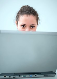 tweeting woman on laptop