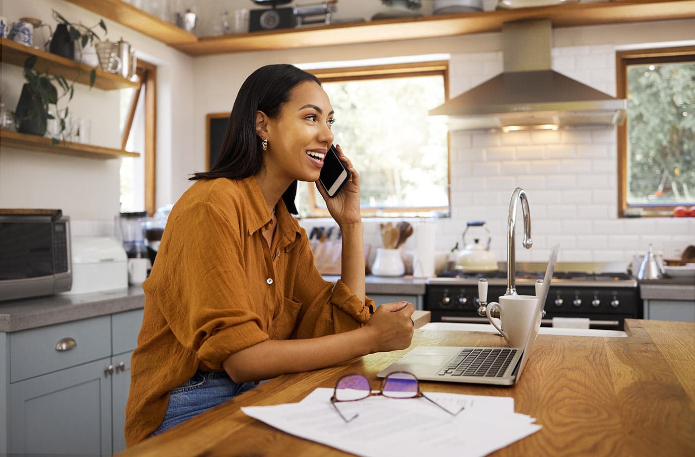 Happy woman talking on the phone